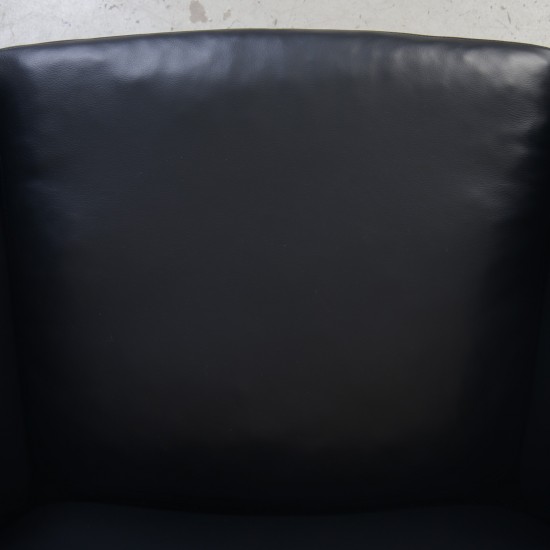 Hans Wegner CH468 Oculus chair reupholstered in black classic leather