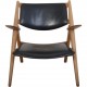 Hans Wegner CH28 Savbukke lænestol i eg og sort læder 1960'erne
