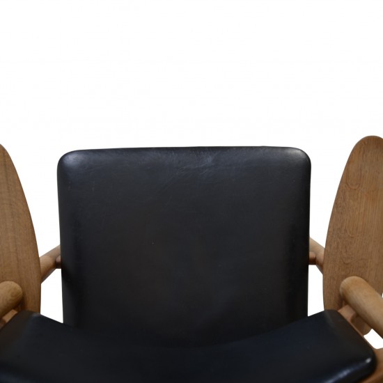 Hans Wegner CH28 Savbukke lænestol i eg og sort læder 1960'erne