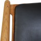 Hans Wegner CH28 Savbukkestol i eg og sort læder