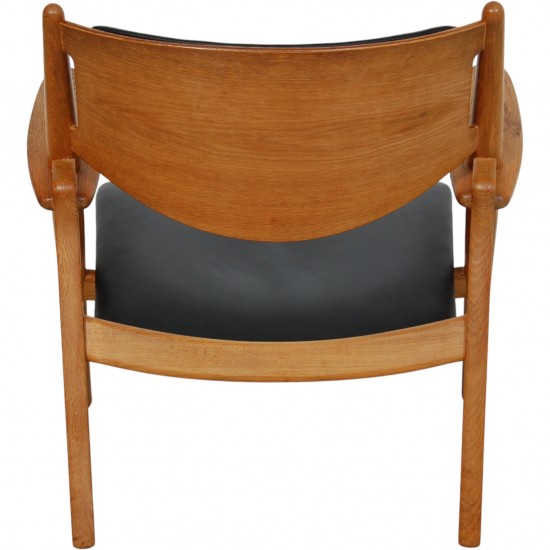 Hans Wegner CH28 Savbukkestol i eg og sort læder