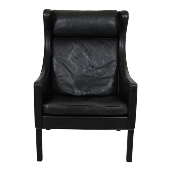 Børge Mogensen Wingchair in black leather with patina, and black legs