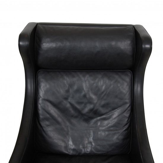 Børge Mogensen Wingchair in black leather with patina, and black legs