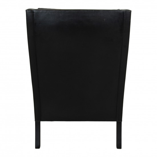Børge Mogensen Wingchair in black leather with patina, and black legs