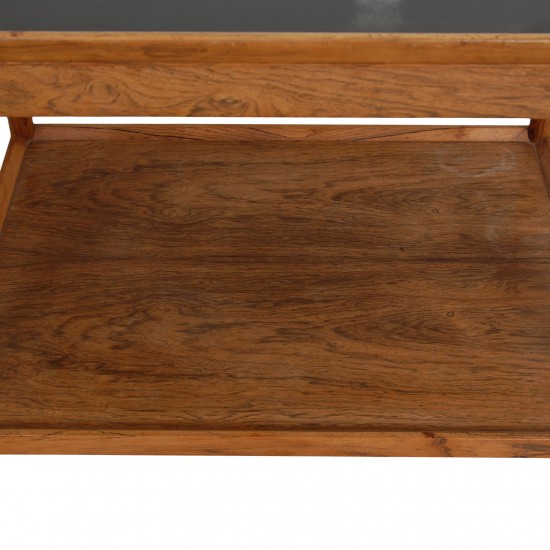 Serving table of rosewood and with a black table top 50x69