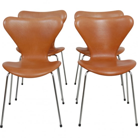 Set of four Arne Jacobsen Seven chairs in patinated cognac leather