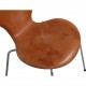 Set of four Arne Jacobsen Seven chairs in patinated cognac leather