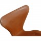 Set of four Arne Jacobsen Seven chairs in patinated cognac leather
