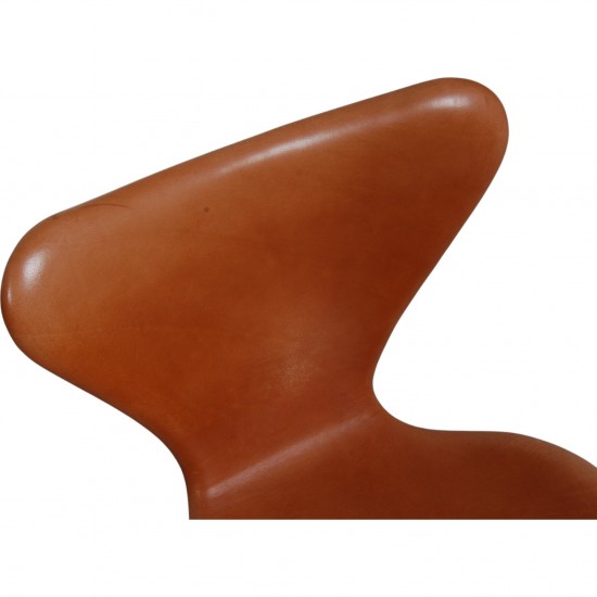 Set of four Arne Jacobsen Seven chairs in patinated cognac leather