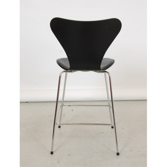 Arne Jacobsen barstool front upholstered in black leather