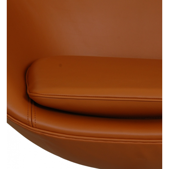  Arne Jacobsen Egg chair Reupholstered in whisky-colored Nevada aniline leather with repair