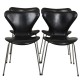 Set of four Arne Jacobsen Seven chairs in black leather