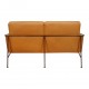 Arne Jacobsen 2-seater Airport sofa with cognac aniline leather and brass frame.