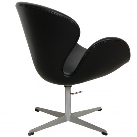 Arne Jacobsen height adjustable Swan chair in black classic leather