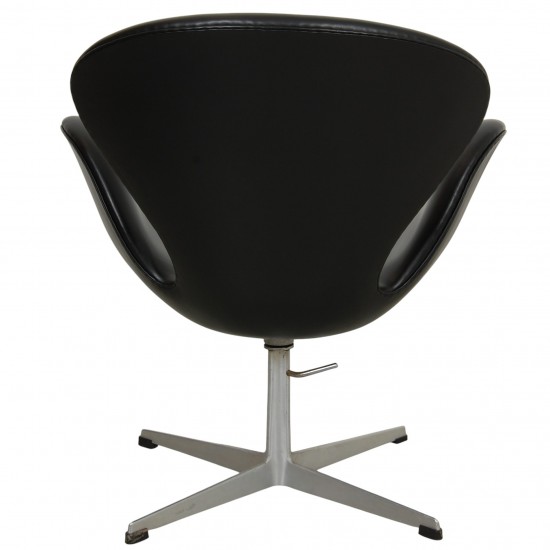 Arne Jacobsen height adjustable Swan chair in black classic leather