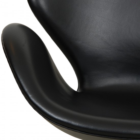 Arne Jacobsen height adjustable Swan chair in black classic leather