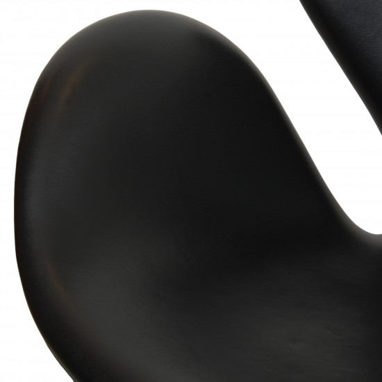 Arne Jacobsen height adjustable Swan chair in black classic leather