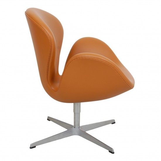 Arne Jacobsen Swan newly upholstered in cognac Nevada aniline leather