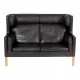 Børge Mogensen 2 pers Coupé sofa with black patinated leather and oak wood legs