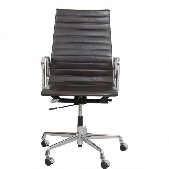 Charles Eames Ea-119 office chair with patinated dark brown leather