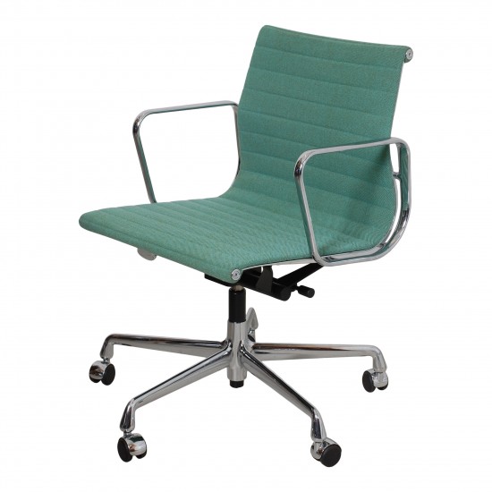 Charles Eames EA-117 office chair with green fabric and a chrome frame