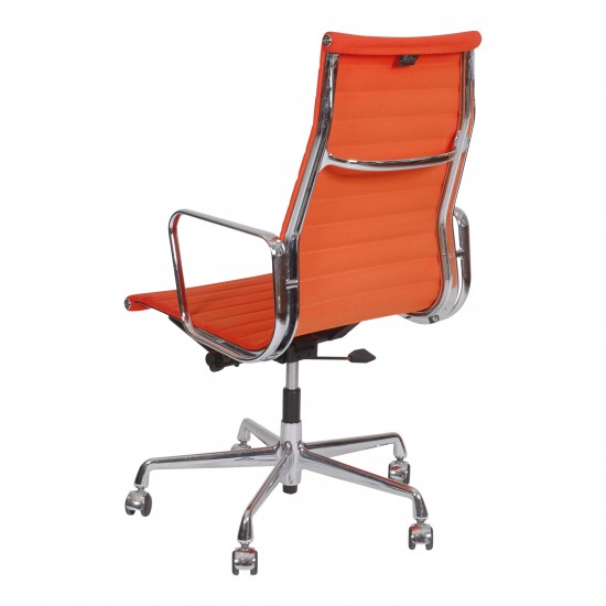 Charles Eames Ea-119 office chair with patinated orange fabric