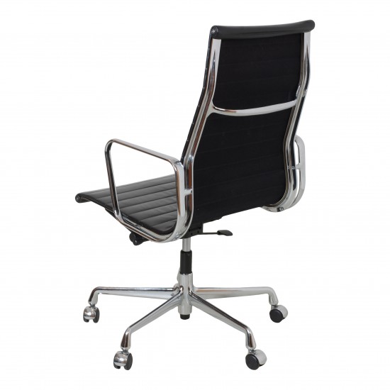 Charles Eames Ea-119 office chair with black leather and chrome frame, nice patina