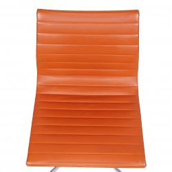 Charles Eames EA-105 chair with cognac leather