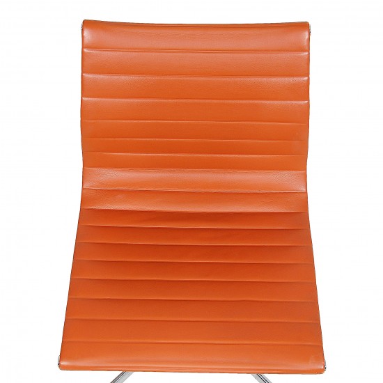 Charles Eames EA-105 chair with cognac leather