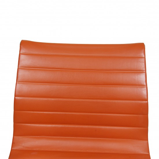 Charles Eames EA-105 chair with cognac leather