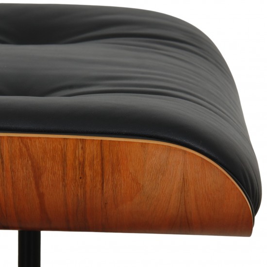 Charles Eames Lounge ottoman in black leather and rosewood