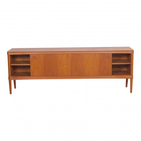 HW Klein (1919-1999) Low teak wood sideboard with sliding doors and drawers