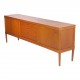 HW Klein (1919-1999) Low teak wood sideboard with sliding doors and drawers