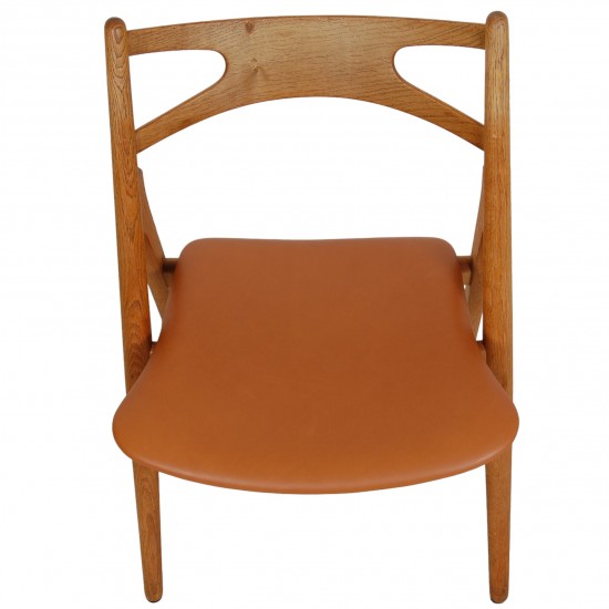 Set of 6 Hans Wegner Sawbuck dining chairs in oak and cognac anilin leather