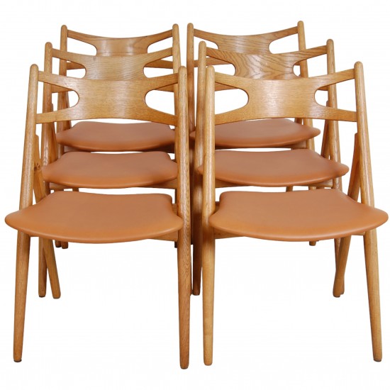 Set of 6 Hans Wegner Sawbuck dining chairs in oak and cognac anilin leather