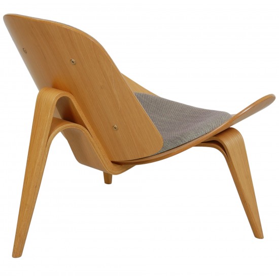 Hans Wegner Shell chair of oak and grey fabric